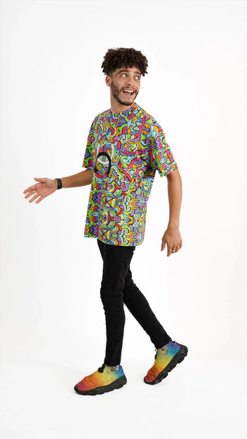 Model wearing Psychedelic Tee with colourful pattern.